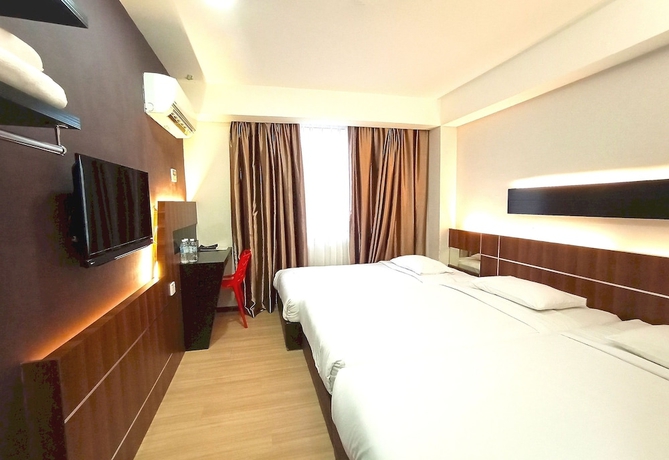 Imagen de la habitación del Hotel O Hi Inn. Foto 6