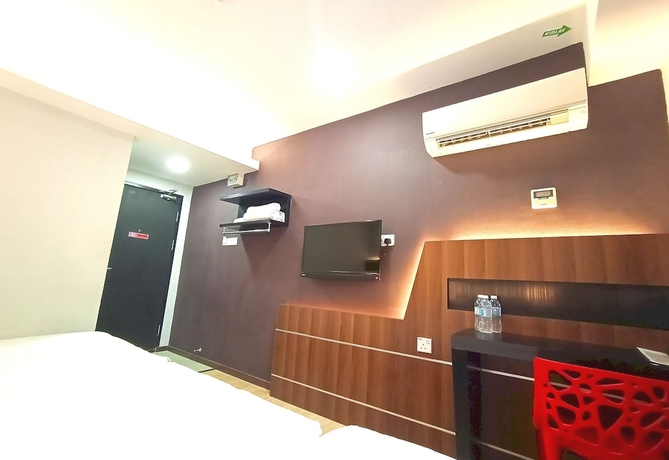 Imagen de la habitación del Hotel O Hi Inn. Foto 7