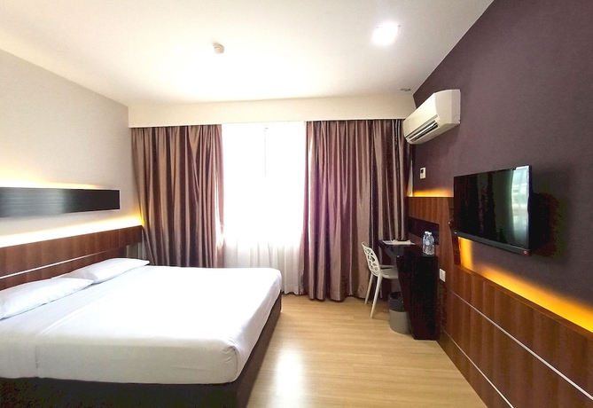 Imagen de la habitación del Hotel O Hi Inn. Foto 8