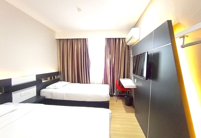 Imagen de la habitación del Hotel O Hi Inn. Foto 10