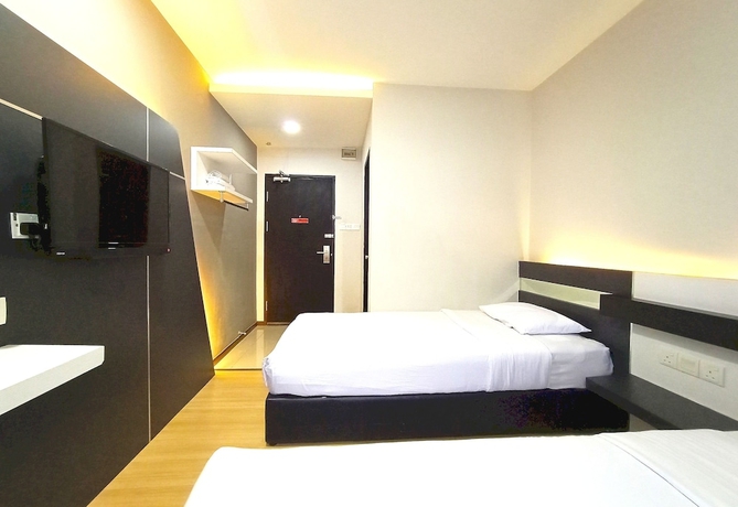 Imagen de la habitación del Hotel O Hi Inn. Foto 11