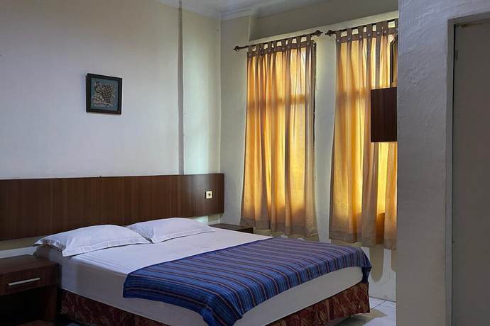 Imagen de la habitación del Hotel O Homestay Pakmuklis Syariah 2 Near Taman Mini Lhokseumawe. Foto 3