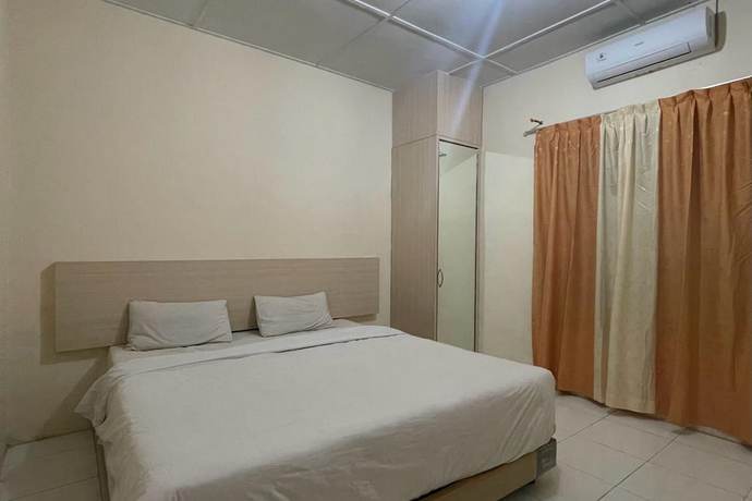 Imagen de la habitación del Hotel O Homestay Pakmuklis Syariah 2 Near Taman Mini Lhokseumawe. Foto 7