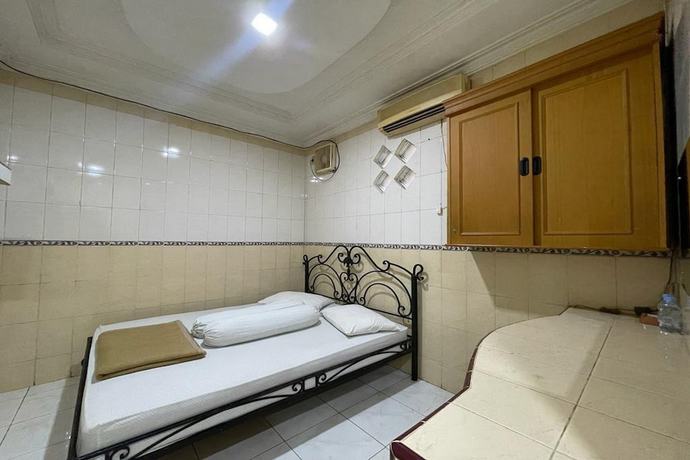 Imagen de la habitación del Hotel O Homestay Pakmuklis Syariah 2 Near Taman Mini Lhokseumawe. Foto 8