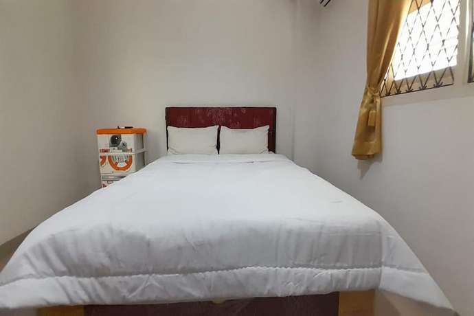 Imagen de la habitación del Hotel O Homestay Pakmuklis Syariah 2 Near Taman Mini Lhokseumawe. Foto 9