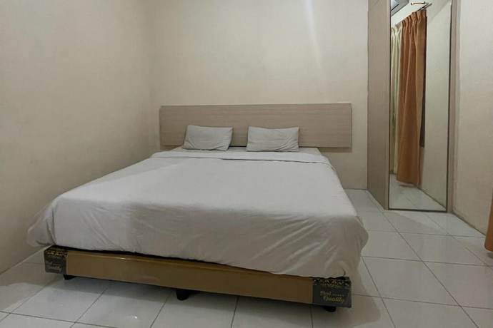 Imagen de la habitación del Hotel O Homestay Pakmuklis Syariah 2 Near Taman Mini Lhokseumawe. Foto 10