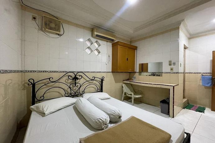 Imagen de la habitación del Hotel O Homestay Pakmuklis Syariah 2 Near Taman Mini Lhokseumawe. Foto 11