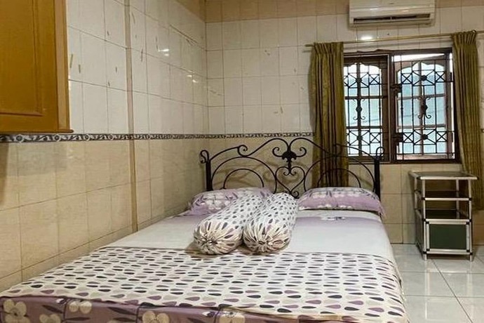 Imagen de la habitación del Hotel O Homestay Pakmuklis Syariah 2 Near Taman Mini Lhokseumawe. Foto 12