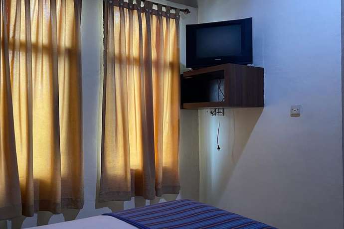 Imagen de la habitación del Hotel O Homestay Pakmuklis Syariah 2 Near Taman Mini Lhokseumawe. Foto 16