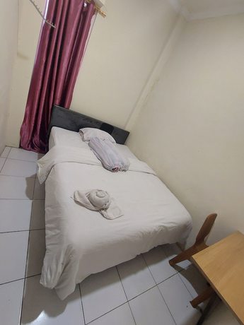 Imagen de la habitación del Hotel O Mahendra HomestayNearTaman Wisata Bukit Rurukan. Foto 9