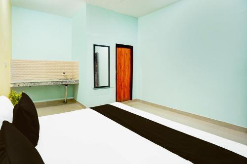 Imagen de la habitación del Hotel O N S Residency. Foto 20