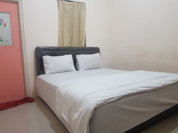 Imagen de la habitación del Hotel O Peaceful Residence. Foto 4