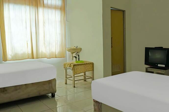 Imagen de la habitación del Hotel O Wilma Kost Syariah. Foto 17