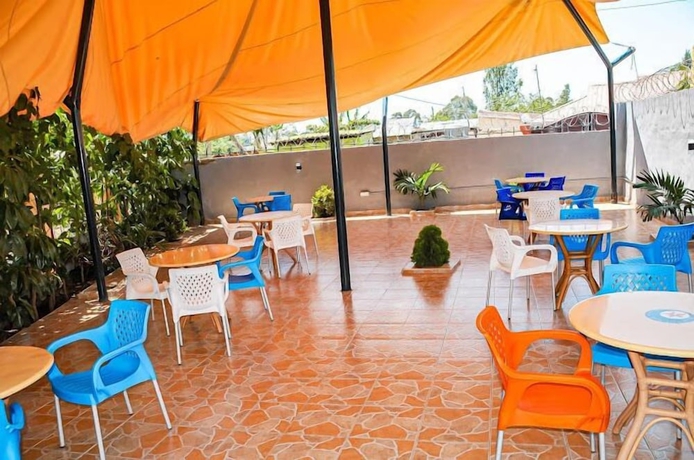 Imagen del bar/restaurante del Hotel ODELIA GARDENS HOTEL, KISUMU. Foto 2