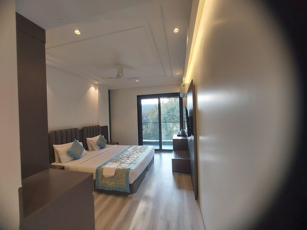 Imagen de la habitación del Hotel OPO Iffco Chowk. Foto 11