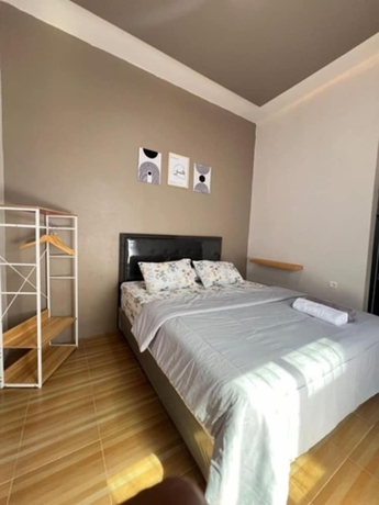 Imagen de la habitación del Hotel OSH Omah Syariah Homestay. Foto 8