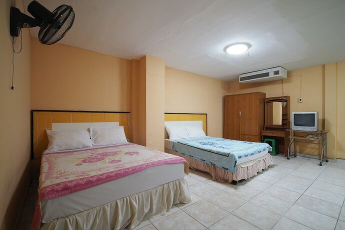 Imagen de la habitación del Hotel OYO 1004 Naklua Mansion. Foto 11