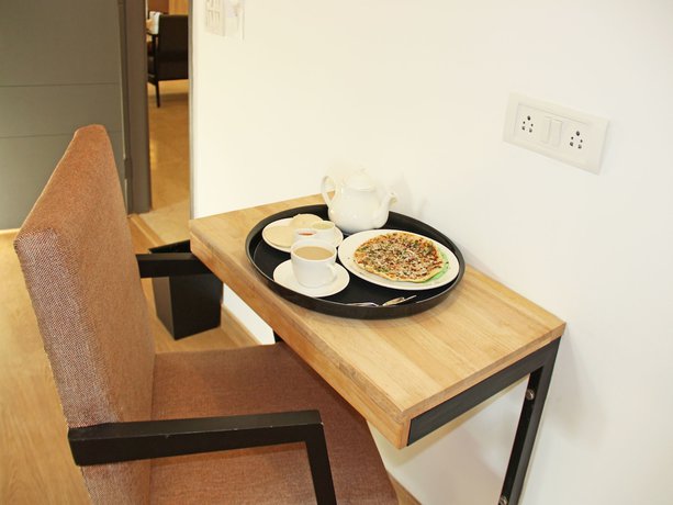 Imagen del bar/restaurante del Hotel OYO 10069 Peter\'s Hill View Residency. Foto 2