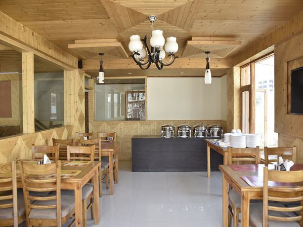 Imagen del bar/restaurante del Hotel OYO 10255 Red Apple. Foto 8