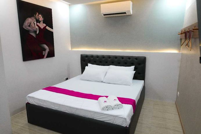 Imagen de la habitación del Hotel OYO 1030 AI. Foto 2