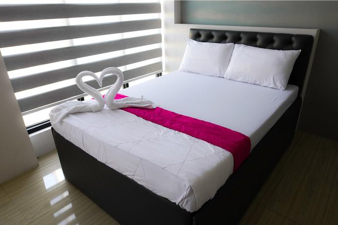 Imagen de la habitación del Hotel OYO 1030 AI. Foto 9