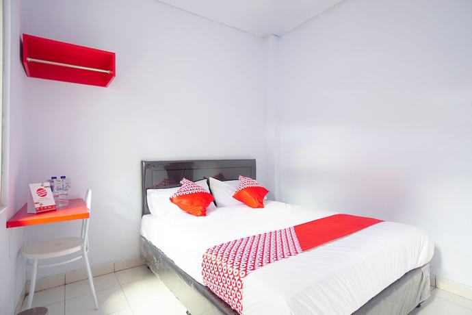 Imagen de la habitación del Hotel OYO 1064 Manado Airport Homestay. Foto 11