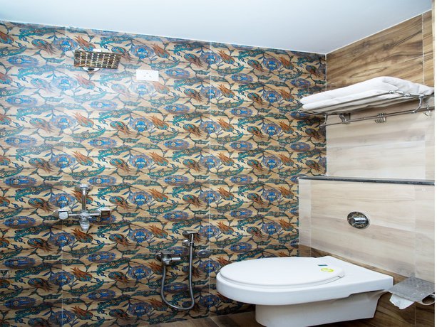 Imagen de la habitación del Hotel OYO 10893 Divine Inn. Foto 16