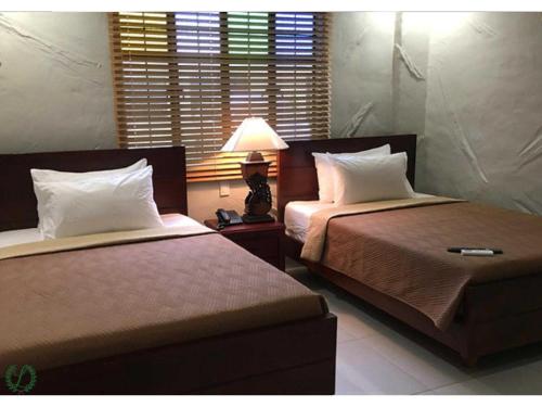 Imagen de la habitación del Hotel OYO 1090 Laurel Heritage Resort and Spa. Foto 19