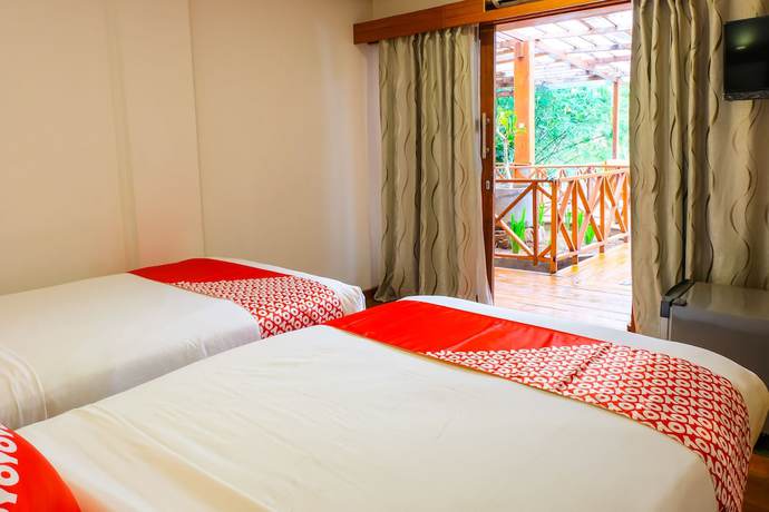 Imagen de la habitación del Hotel OYO 1099 Bandini Riverside Cottage. Foto 2