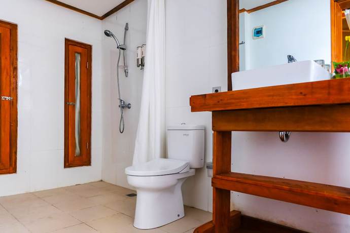 Imagen de la habitación del Hotel OYO 1099 Bandini Riverside Cottage. Foto 7