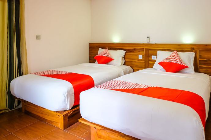 Imagen de la habitación del Hotel OYO 1099 Bandini Riverside Cottage. Foto 13