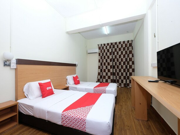 Imagen de la habitación del Hotel OYO 1105 Hotel 75. Foto 8