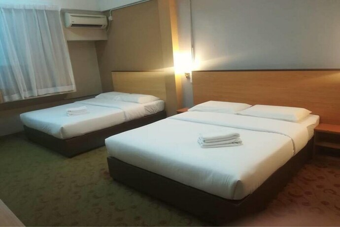 Imagen de la habitación del Hotel OYO 1105 Hotel 75. Foto 14