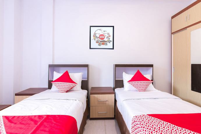 Imagen de la habitación del Hotel OYO 1118 Artomoro Family Guesthouse. Foto 4
