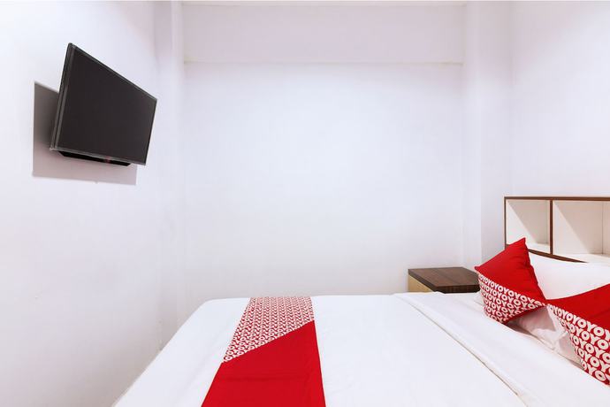 Imagen de la habitación del Hotel OYO 1118 Artomoro Family Guesthouse. Foto 6