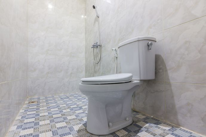 Imagen de la habitación del Hotel OYO 1118 Artomoro Family Guesthouse. Foto 9