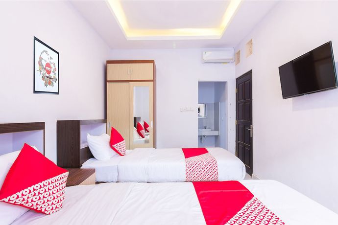 Imagen de la habitación del Hotel OYO 1118 Artomoro Family Guesthouse. Foto 11