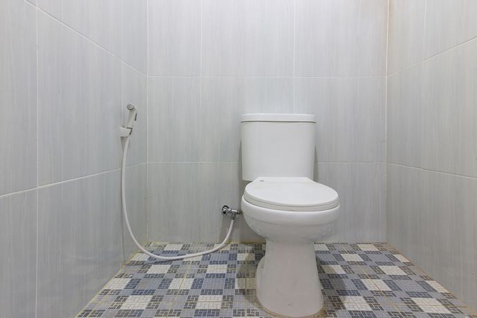 Imagen de la habitación del Hotel OYO 1118 Artomoro Family Guesthouse. Foto 13