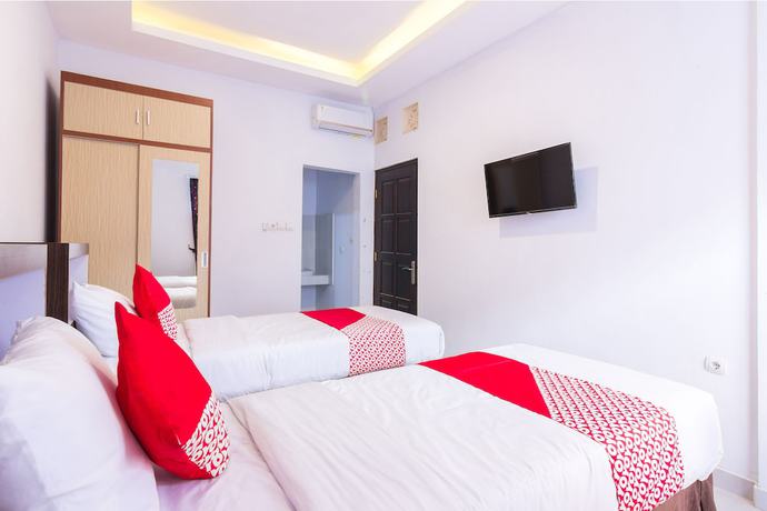 Imagen de la habitación del Hotel OYO 1118 Artomoro Family Guesthouse. Foto 15