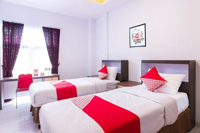 Imagen de la habitación del Hotel OYO 1118 Artomoro Family Guesthouse. Foto 16