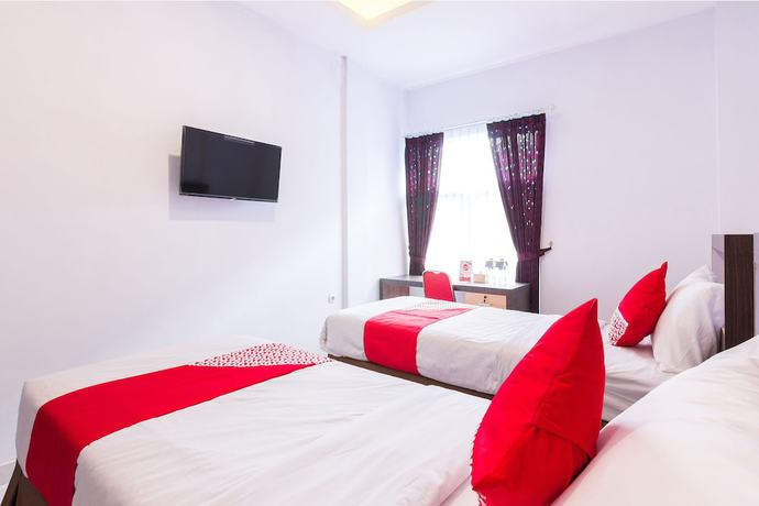 Imagen de la habitación del Hotel OYO 1118 Artomoro Family Guesthouse. Foto 17