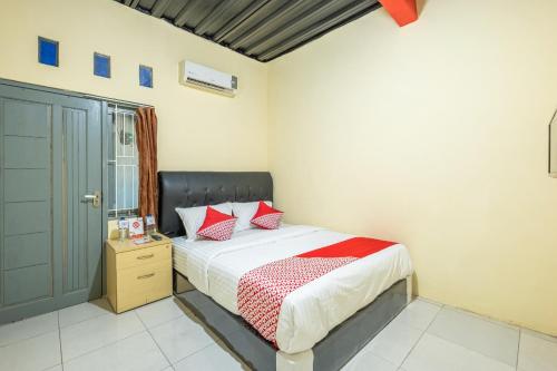 Imagen de la habitación del Hotel OYO 1120 Grand Liquid. Foto 4