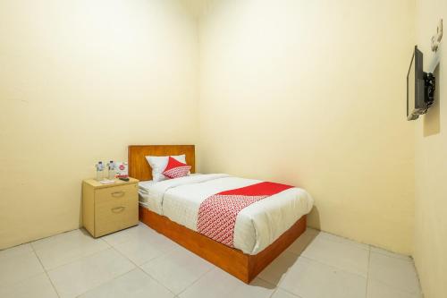 Imagen de la habitación del Hotel OYO 1120 Grand Liquid. Foto 5