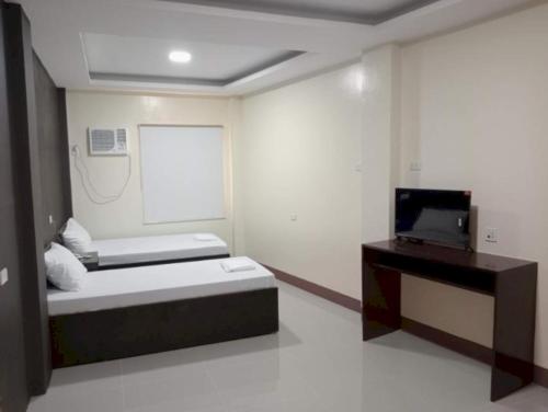 Imagen de la habitación del Hotel OYO 1122 Ranchotel Aklan. Foto 17