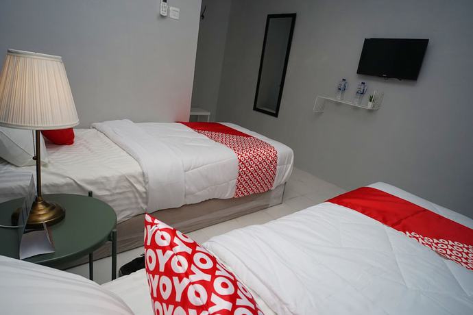 Imagen de la habitación del Hotel OYO 1125 Sani Guest House. Foto 4