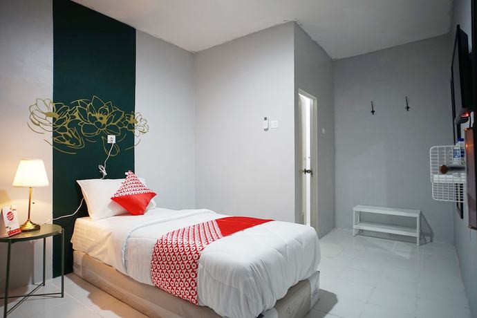 Imagen de la habitación del Hotel OYO 1125 Sani Guest House. Foto 5