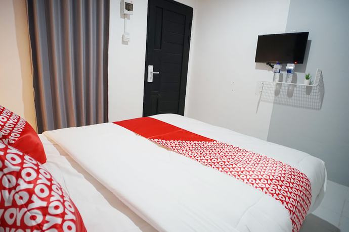 Imagen de la habitación del Hotel OYO 1125 Sani Guest House. Foto 6
