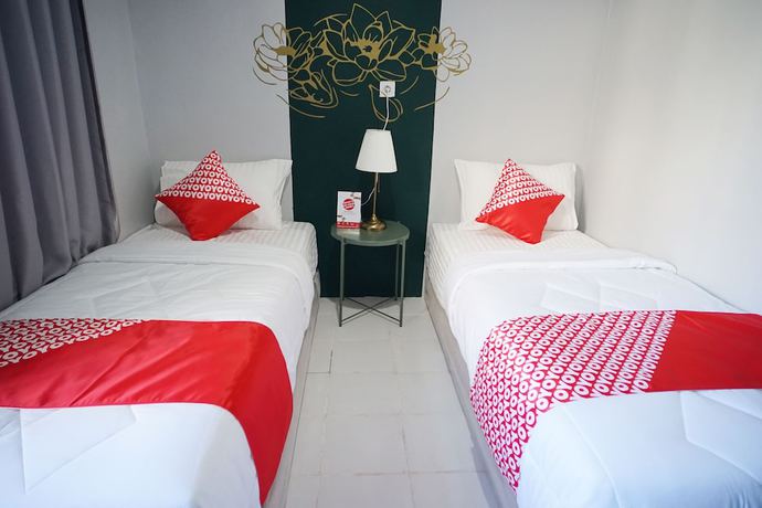 Imagen de la habitación del Hotel OYO 1125 Sani Guest House. Foto 7