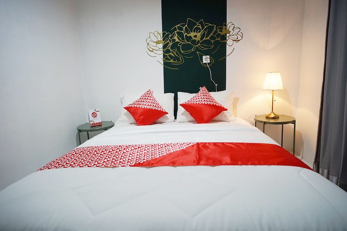 Imagen de la habitación del Hotel OYO 1125 Sani Guest House. Foto 9