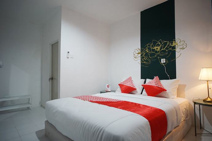 Imagen de la habitación del Hotel OYO 1125 Sani Guest House. Foto 11